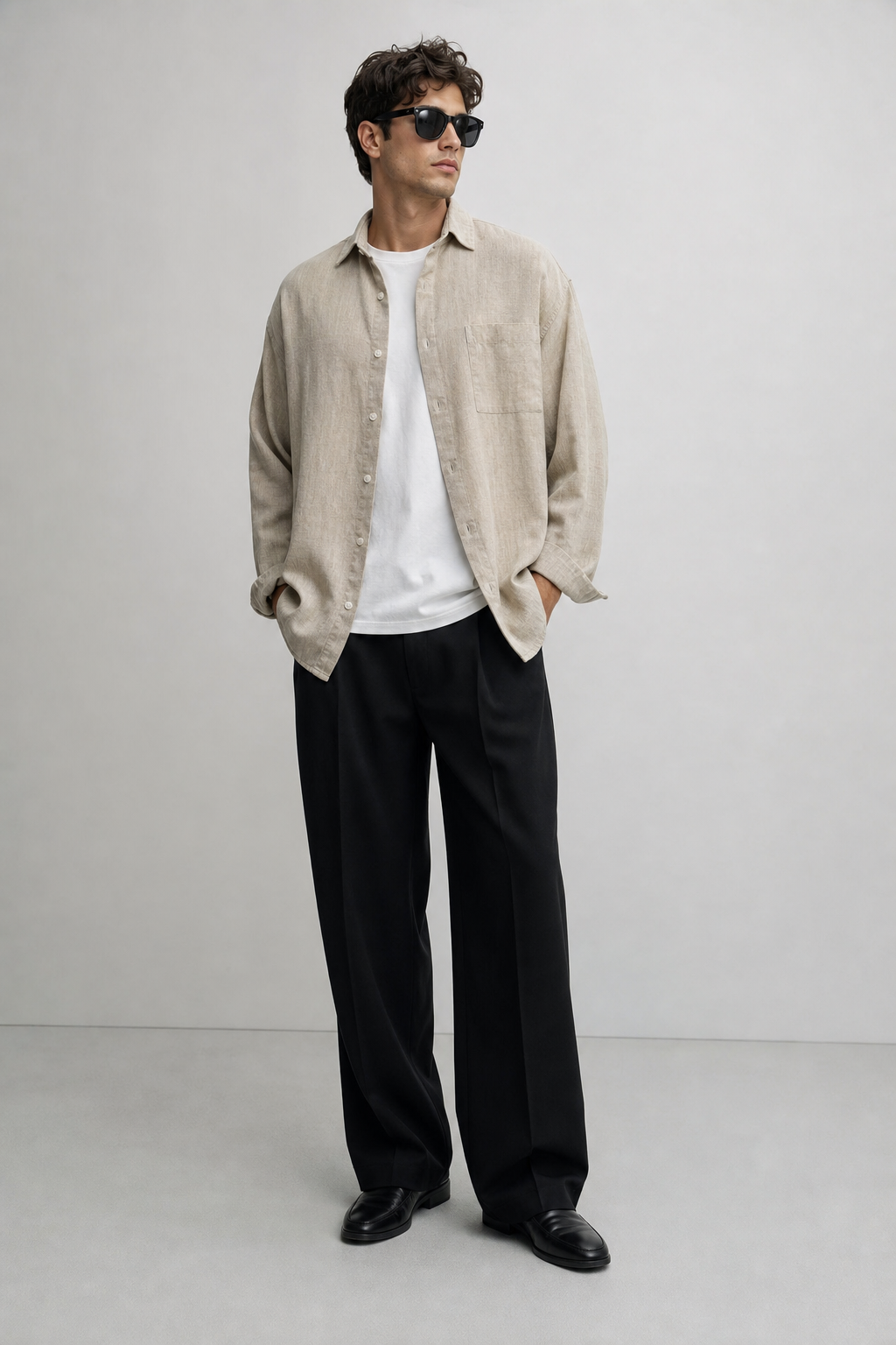 Male model in beige overshirt and black trousers